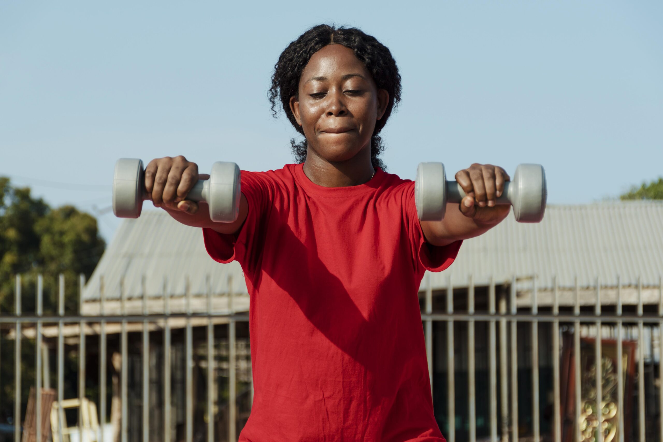 medium-shot-woman-holding-dumbbells